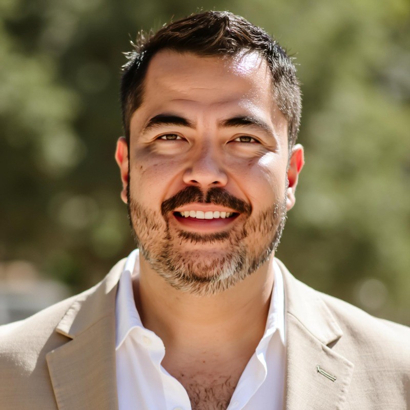 Professional team collaborating on AI technology projects in modern office workspace